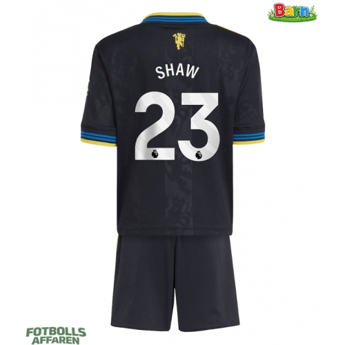 Manchester United Luke Shaw #23 Tredjeställ Barn 2025-26 Kortärmad (+ Korta byxor)